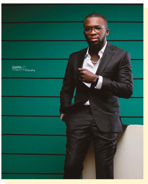 Dr. Lawal ASSANI stand up in bg green